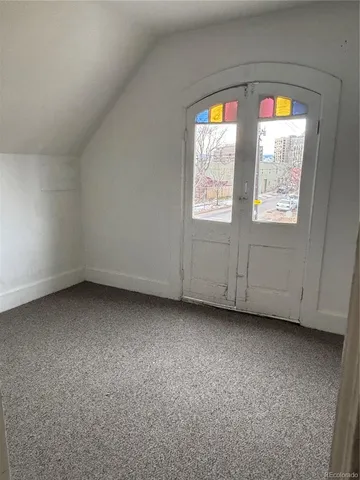 a view of a kitchen with stainless steel appliances granite countertop a refrigerator and a sink