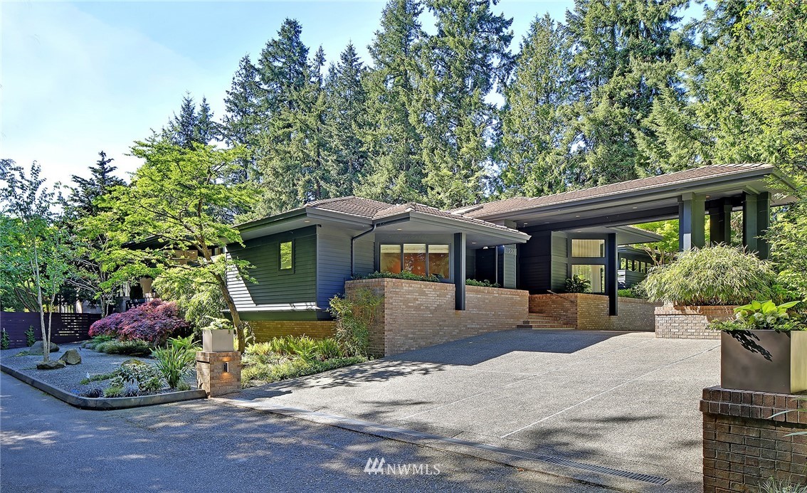 1237 Evergreen Point Road Medina, WA 98039 - Photo 1 of 1 a front view of a house with a yard and potted plants