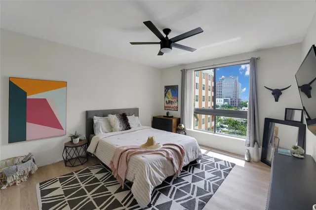 a bedroom with furniture and a window