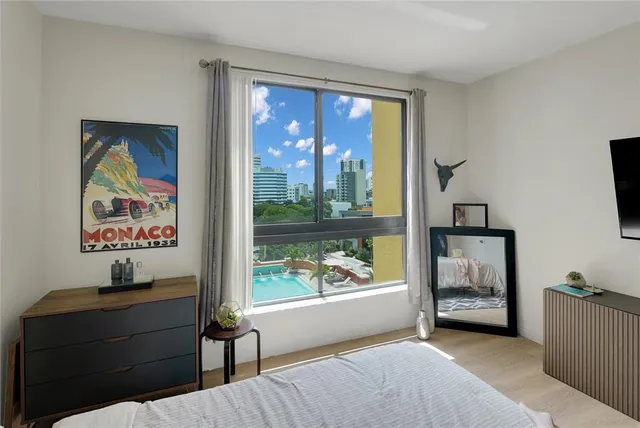 a bedroom with a bed and a chair