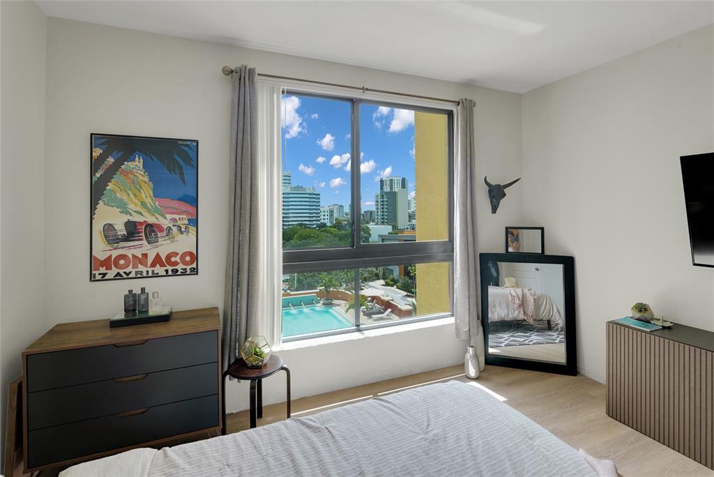 100 North Federal Highway, Unit 819 Fort Lauderdale, FL 33301 - Photo 18 of 36 a bedroom with furniture and a window