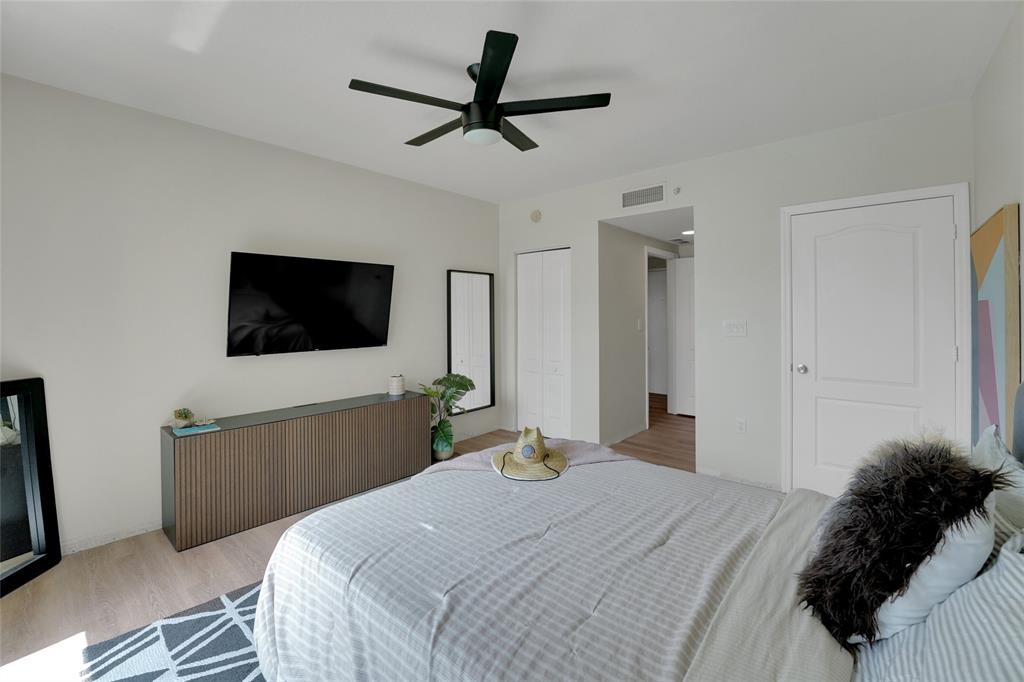 100 North Federal Highway, Unit 819 Fort Lauderdale, FL 33301 - Photo 20 of 36 a bedroom with a bed and a flat tv screen on dresser