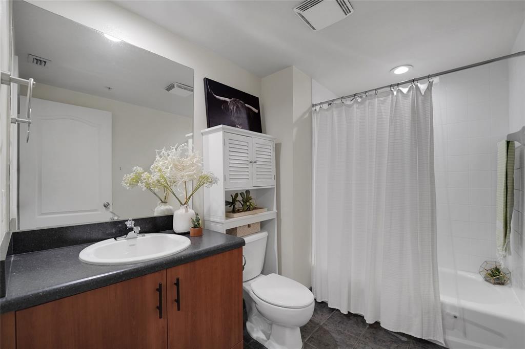 100 North Federal Highway, Unit 819 Fort Lauderdale, FL 33301 - Photo 23 of 36 a bathroom with a sink toilet a mirror and vanity