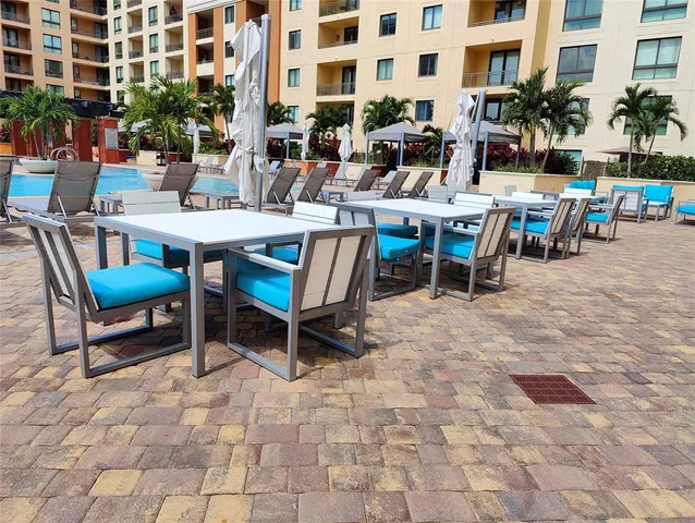 a backyard with table and chairs
