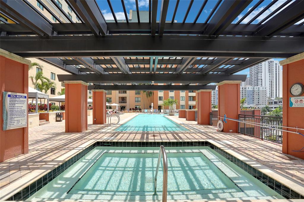 100 North Federal Highway, Unit 819 Fort Lauderdale, FL 33301 - Photo 29 of 36 a backyard with table and chairs