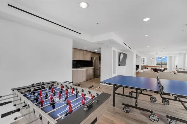 a view of kitchen with sink and wooden floor