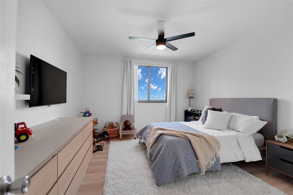 100 North Federal Highway, Unit 819 Fort Lauderdale, FL 33301 - Photo 6 of 36 a bedroom with a bed and a flat screen tv