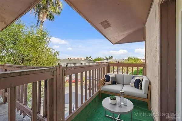 a view of a balcony with an outdoor space