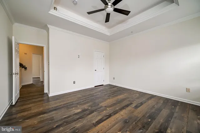 a bathroom with a tub a sink and a window