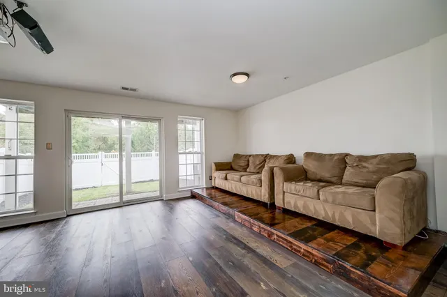 a living room with couch and a large window