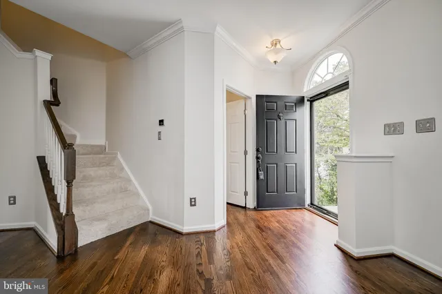 a bathroom with a sink mirror and toilet