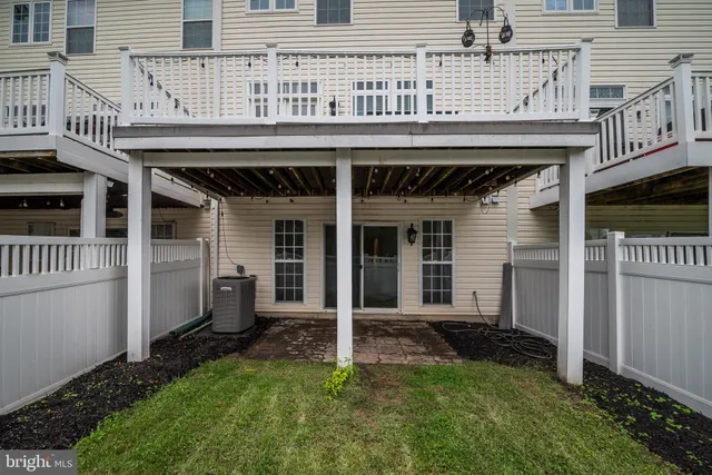 a view of a balcony with wooden floor