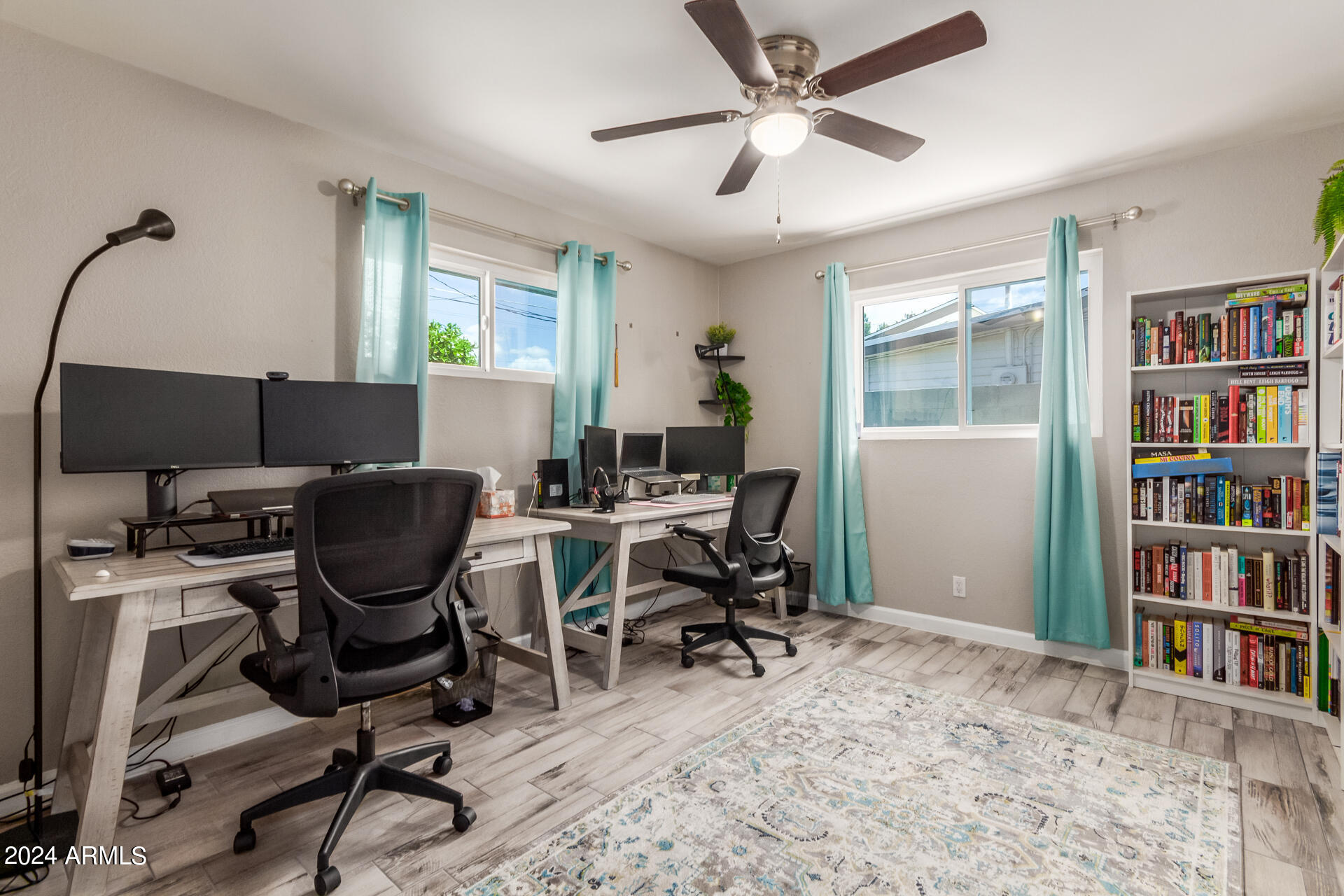 3050 West Charter Oak Road Phoenix, AZ 85029 - Photo 43 of 57 a view of a workspace with furniture and a window
