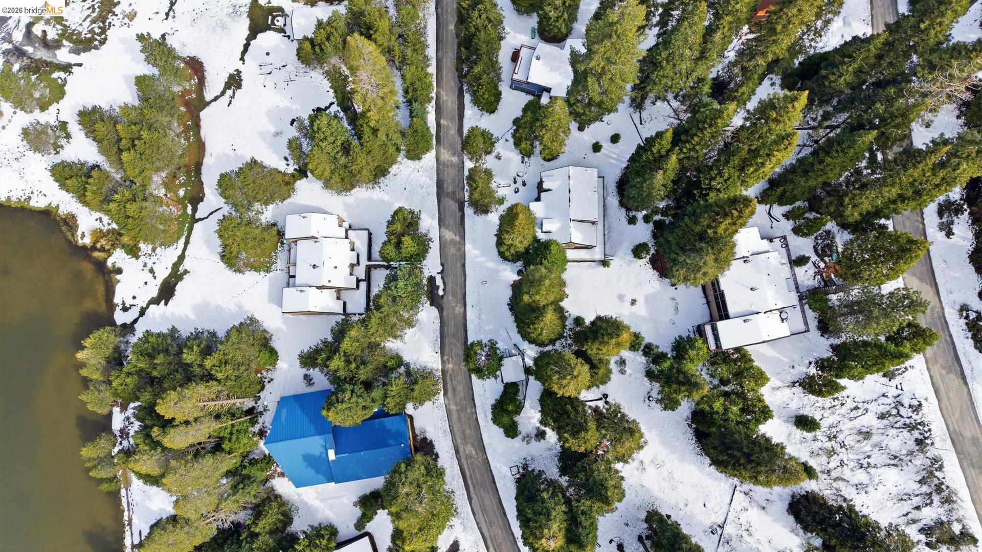33840 Upper Leland Road, Unit 25A Pinecrest, CA 95364 - Photo 33 of 41 an aerial view of a house with a yard and garden