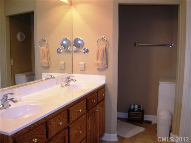 112 Tatum Road Olin, NC 28660 - Photo 11 of 16 a bathroom with a sink and a mirror