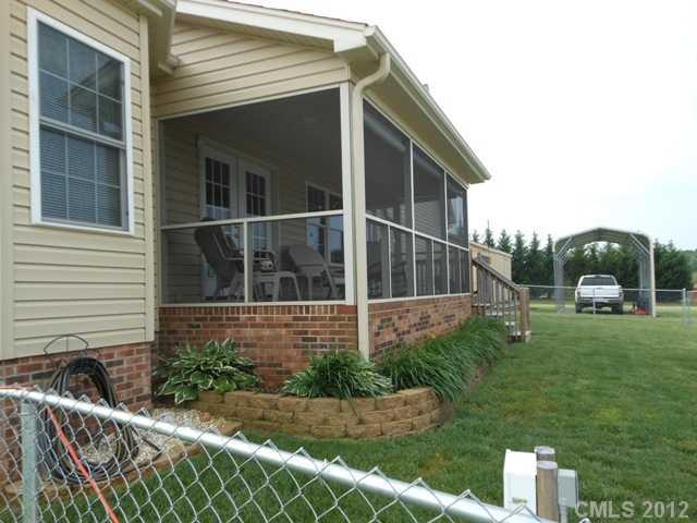 112 Tatum Road Olin, NC 28660 - Photo 12 of 16 a backyard of a house with lots of green space