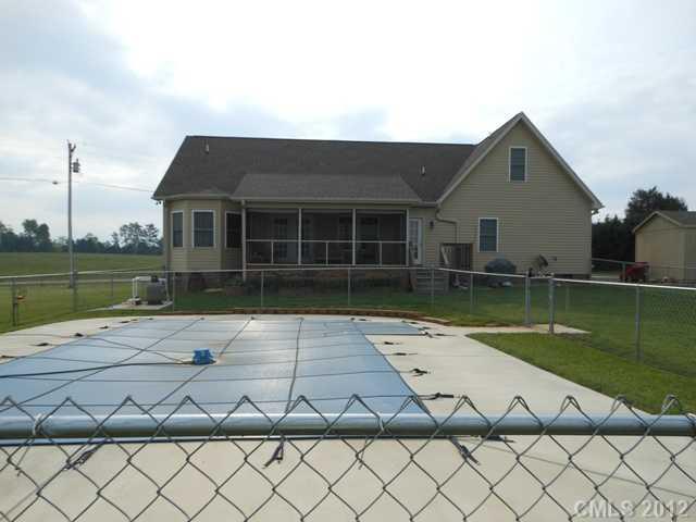 112 Tatum Road Olin, NC 28660 - Photo 16 of 16 a view of a house with a yard and a large window