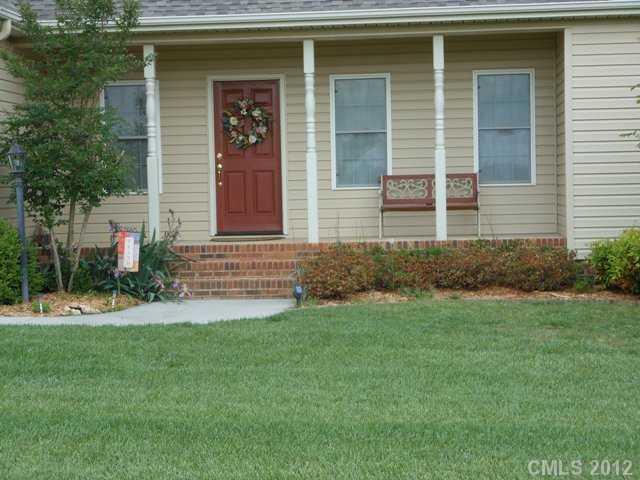 112 Tatum Road Olin, NC 28660 - Photo 3 of 16 a front view of a house with a yard