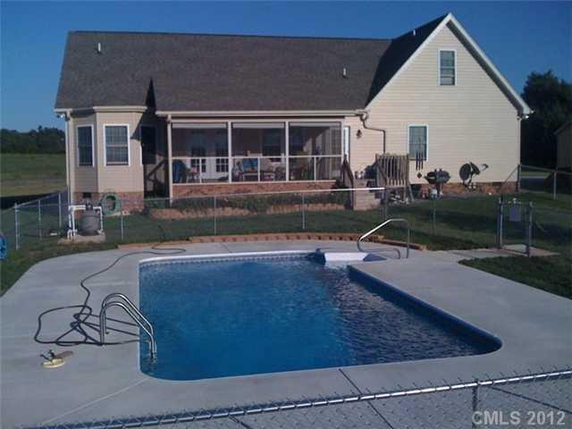 112 Tatum Road Olin, NC 28660 - Photo 4 of 16 a view of a house with backyard