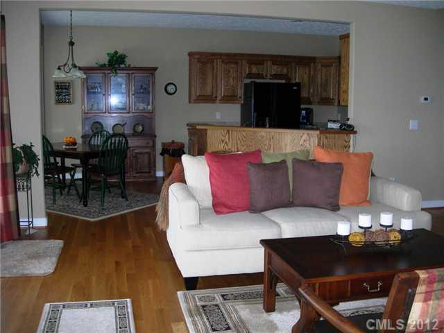 112 Tatum Road Olin, NC 28660 - Photo 8 of 16 a living room with furniture and wooden floor