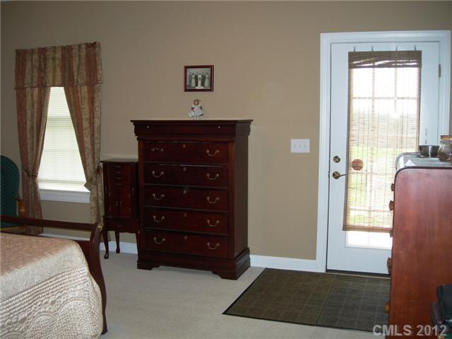112 Tatum Road Olin, NC 28660 - Photo 10 of 16 a bedroom with a bed and a window