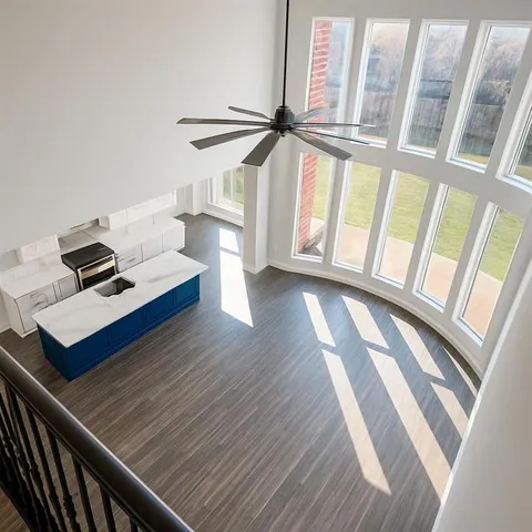 a view of an entryway with wooden floor
