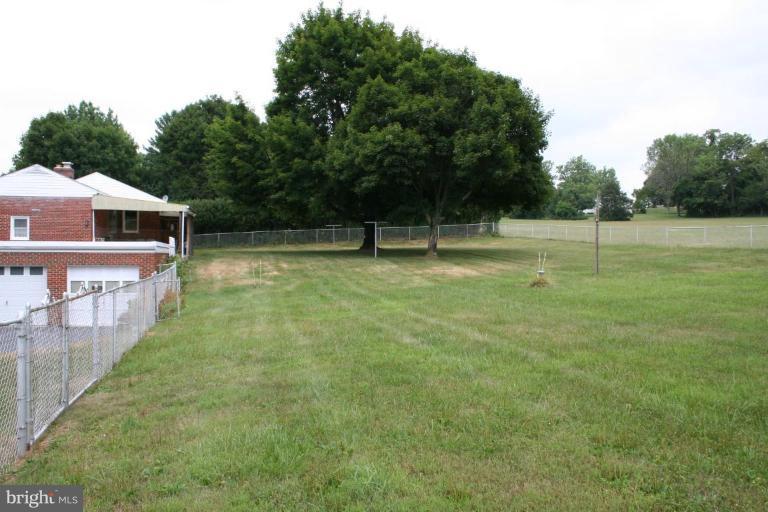 7317 Ridge Road Frederick, MD 21702 - Photo 5 of 11 a view of a house with a yard