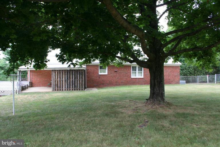 7317 Ridge Road Frederick, MD 21702 - Photo 6 of 11 a view of a yard with a tree