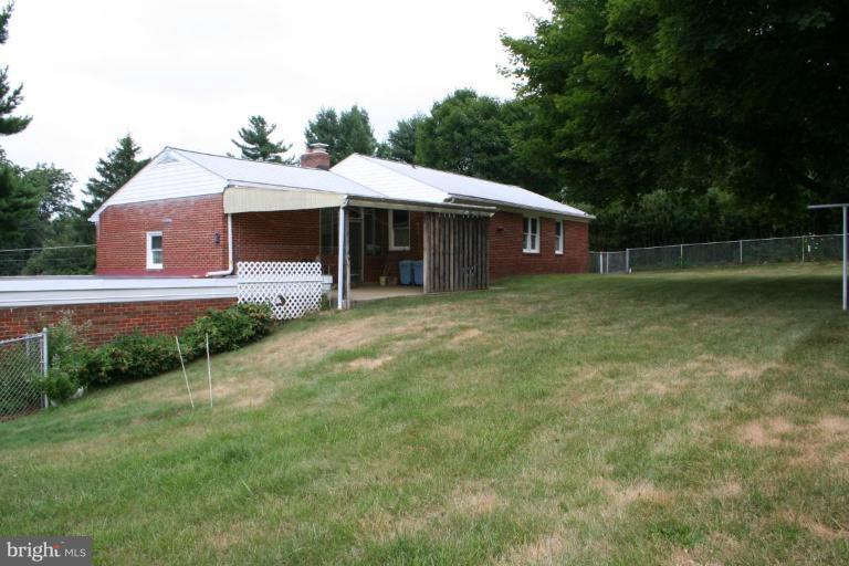 7317 Ridge Road Frederick, MD 21702 - Photo 8 of 11 a front view of a house with garden