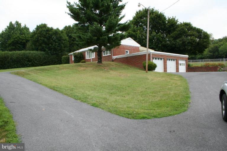 7317 Ridge Road Frederick, MD 21702 - Photo 9 of 11 a view of a house with a backyard