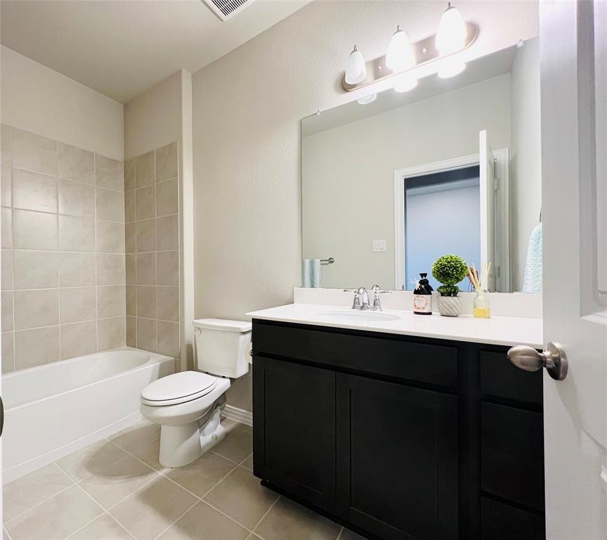 3305 Cross Shr Drive Anna, TX 75409 - Photo 5 of 31 Full bathroom featuring tile patterned flooring, vanity, tiled shower / bath combo, and toilet