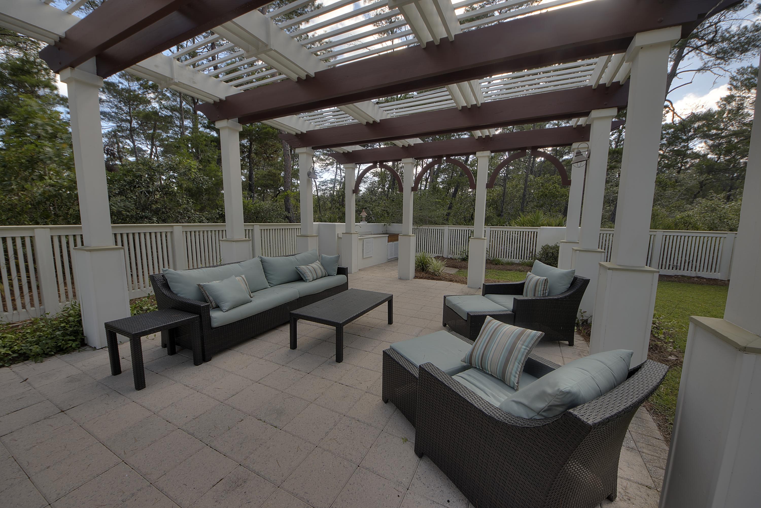 27 Dune Ridge Road Santa Rosa Beach, FL 32459 - Photo 3 of 6 a outdoor living space with furniture and garden view