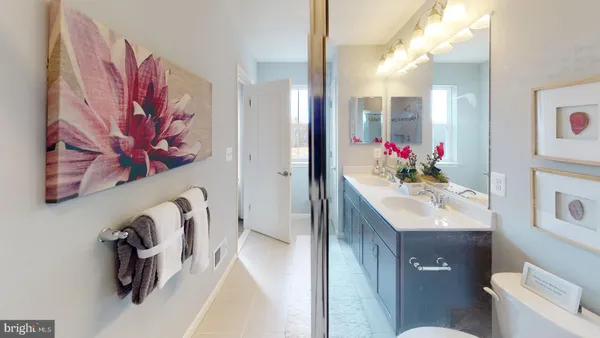 a bathroom with a sink vanity and mirror