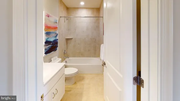 a view of a bathroom with a sink and mirror