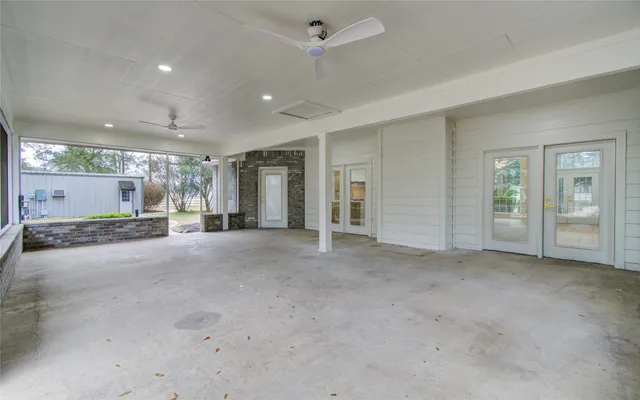 a view of a house with swimming pool and sitting area