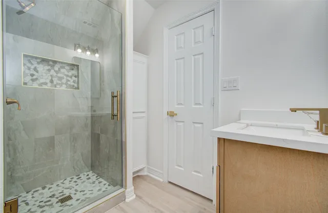 a front view of a house with a garden and yard