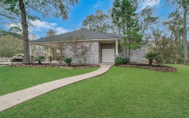 a kitchen with granite countertop a sink and a stove top oven