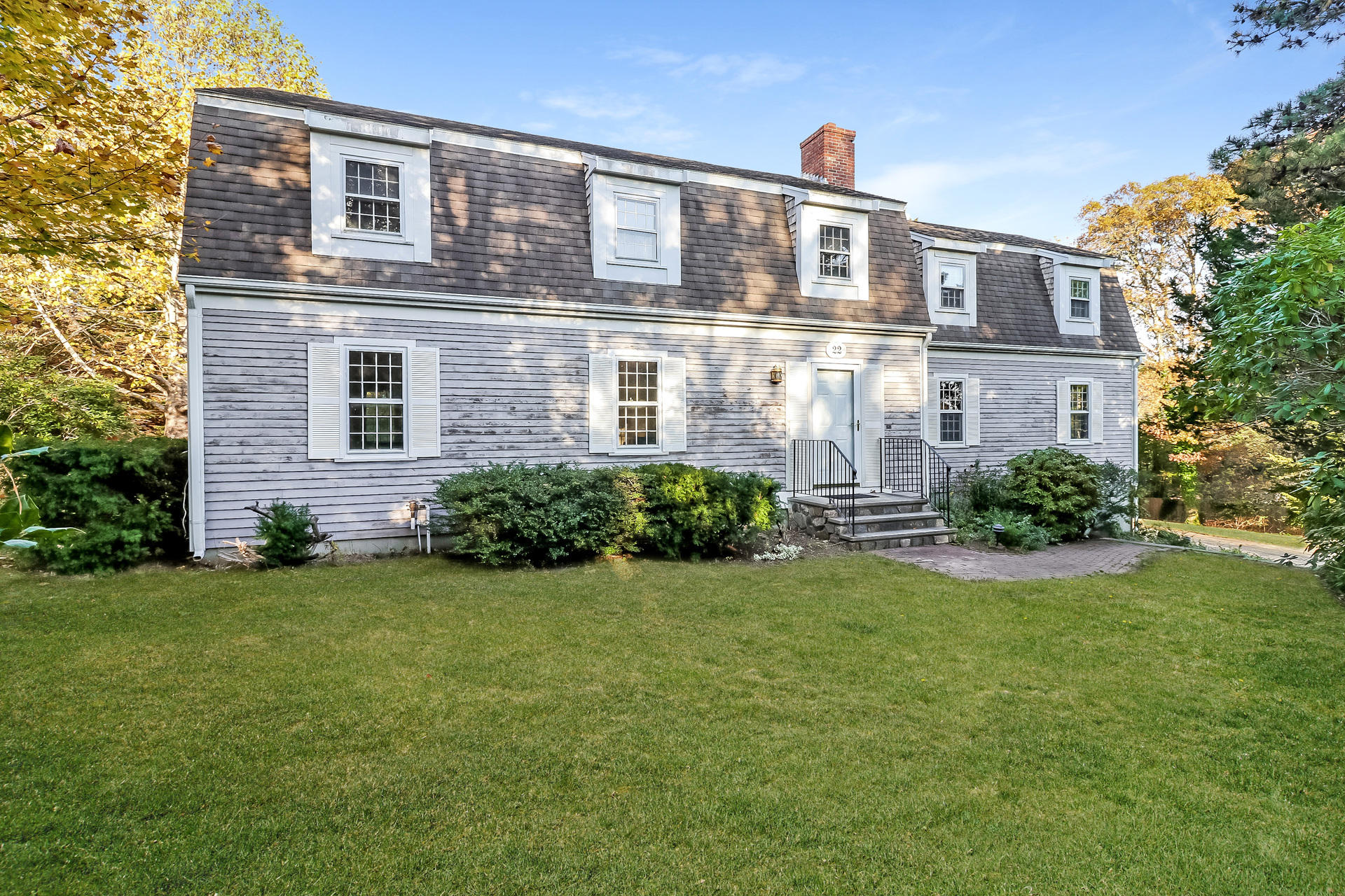 22 Joyce Anne Road Centerville, MA 02632 - Photo 1 of 18 a front view of a house with garden