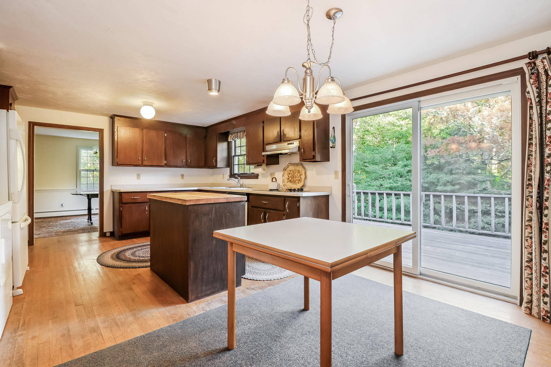 22 Joyce Anne Road Centerville, MA 02632 - Photo 7 of 18 a kitchen with kitchen island a large counter top space appliances and a center island