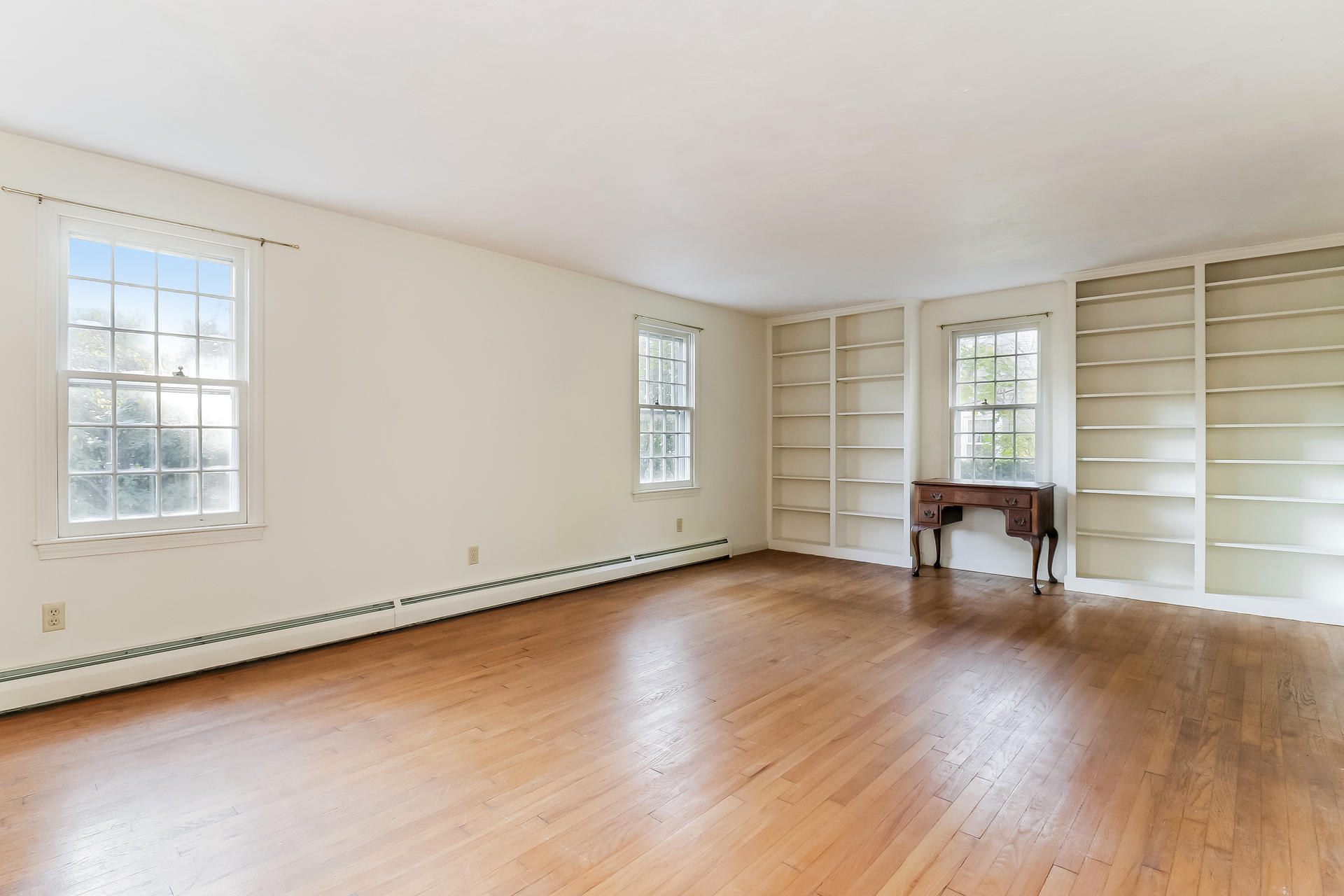22 Joyce Anne Road Centerville, MA 02632 - Photo 9 of 18 a view of an empty room with window and wooden floor