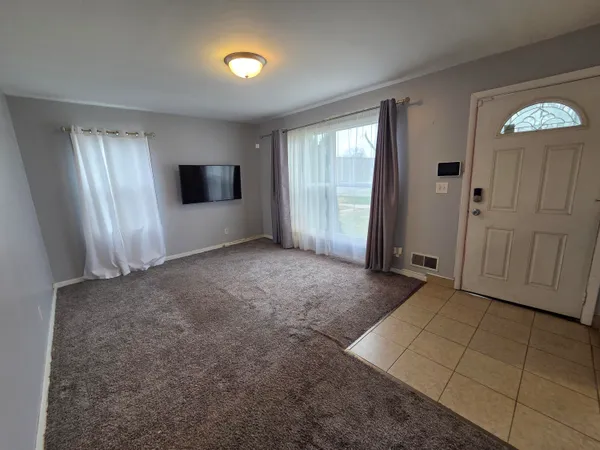 a view of livingroom with furniture and window