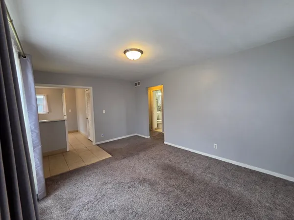 an empty room with entrance and door