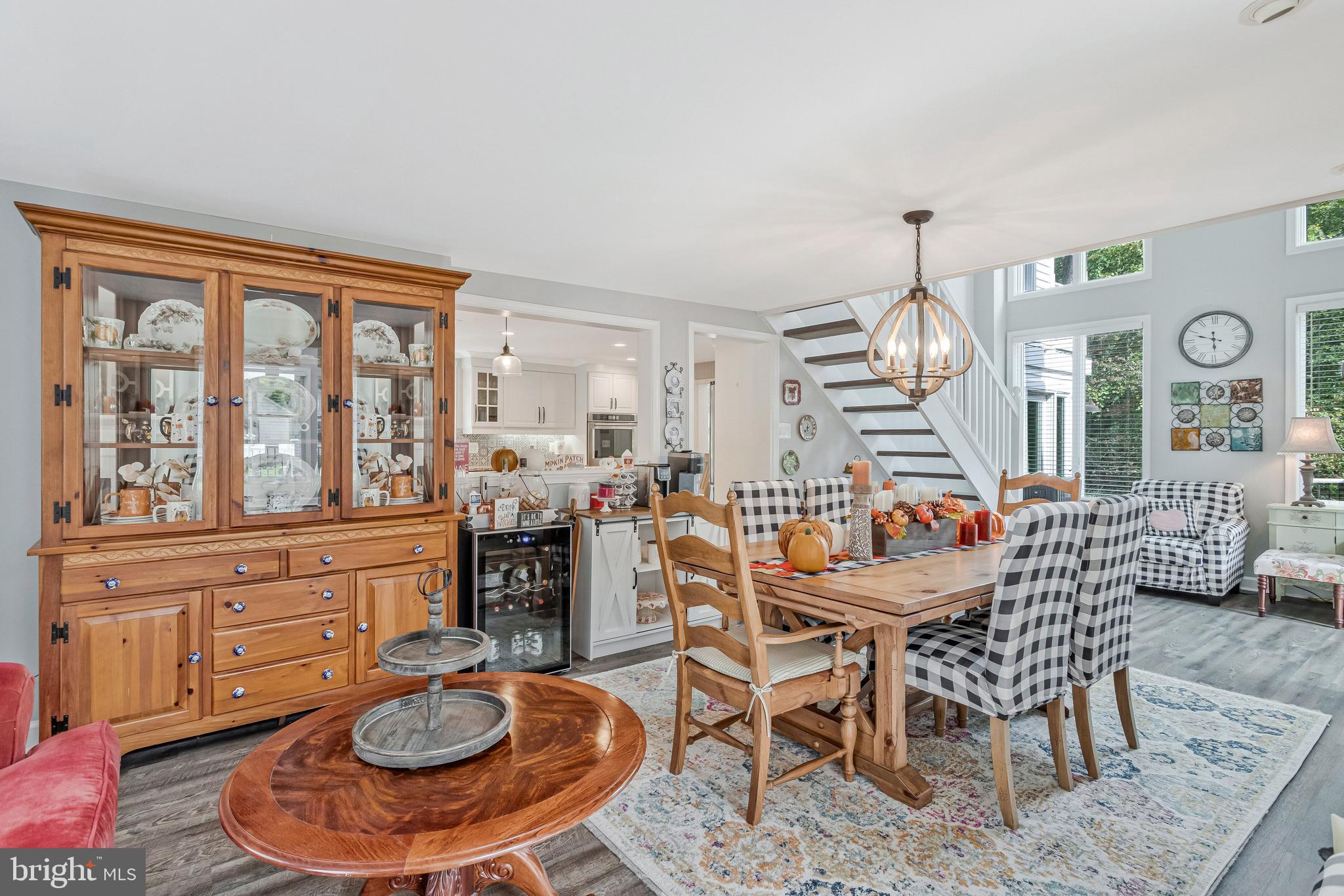 605 Barstow Road Prince Frederick, MD 20678 - Photo 15 of 57 a dining room with furniture a rug and a large window