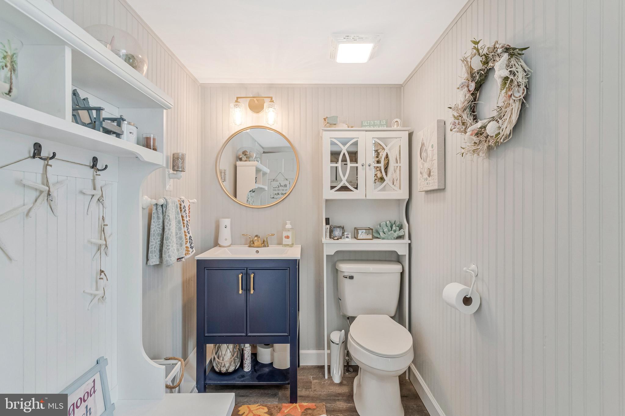 605 Barstow Road Prince Frederick, MD 20678 - Photo 19 of 57 a bathroom with a toilet a sink and a mirror