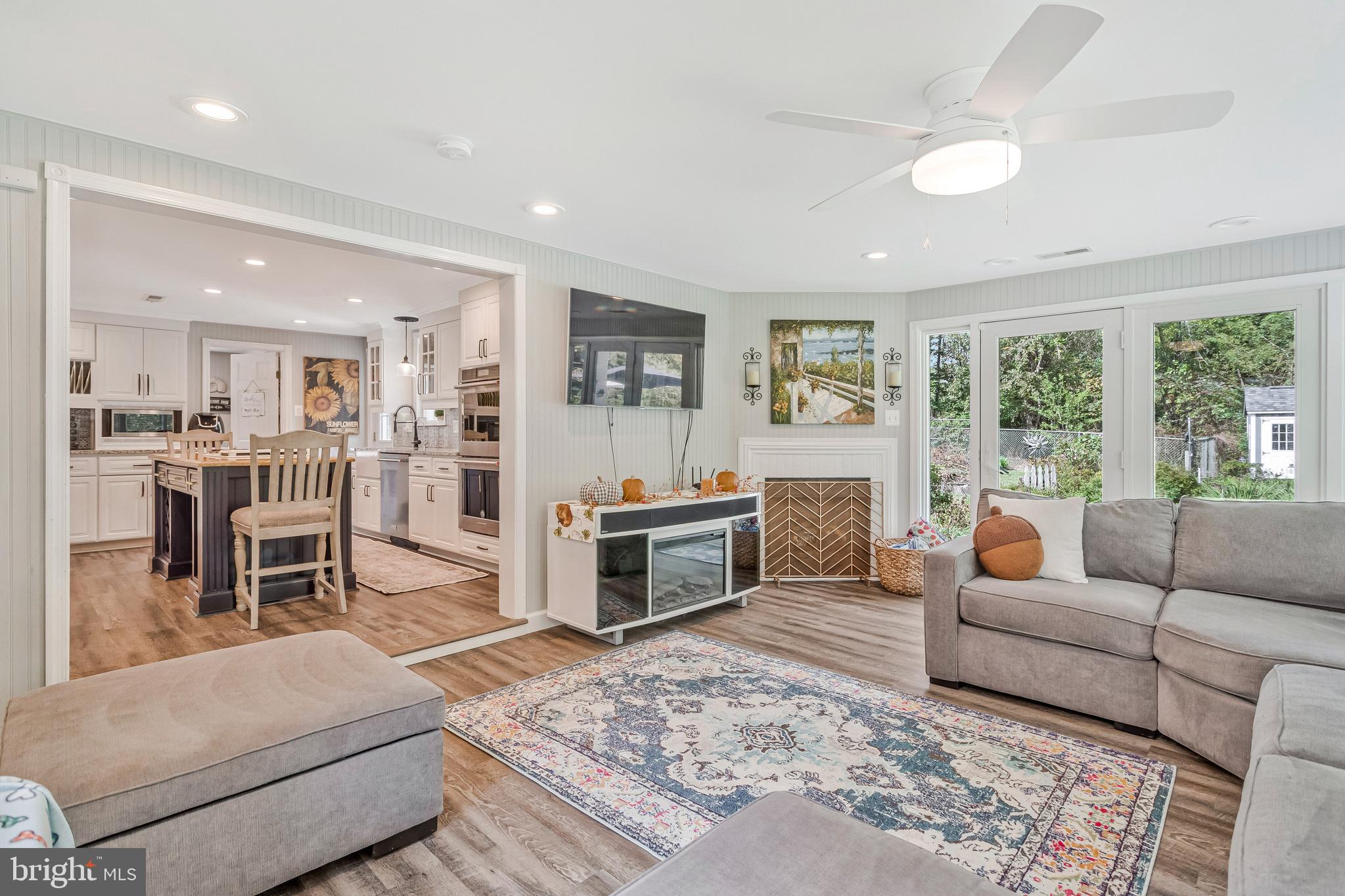 605 Barstow Road Prince Frederick, MD 20678 - Photo 22 of 57 a living room with furniture and a fireplace