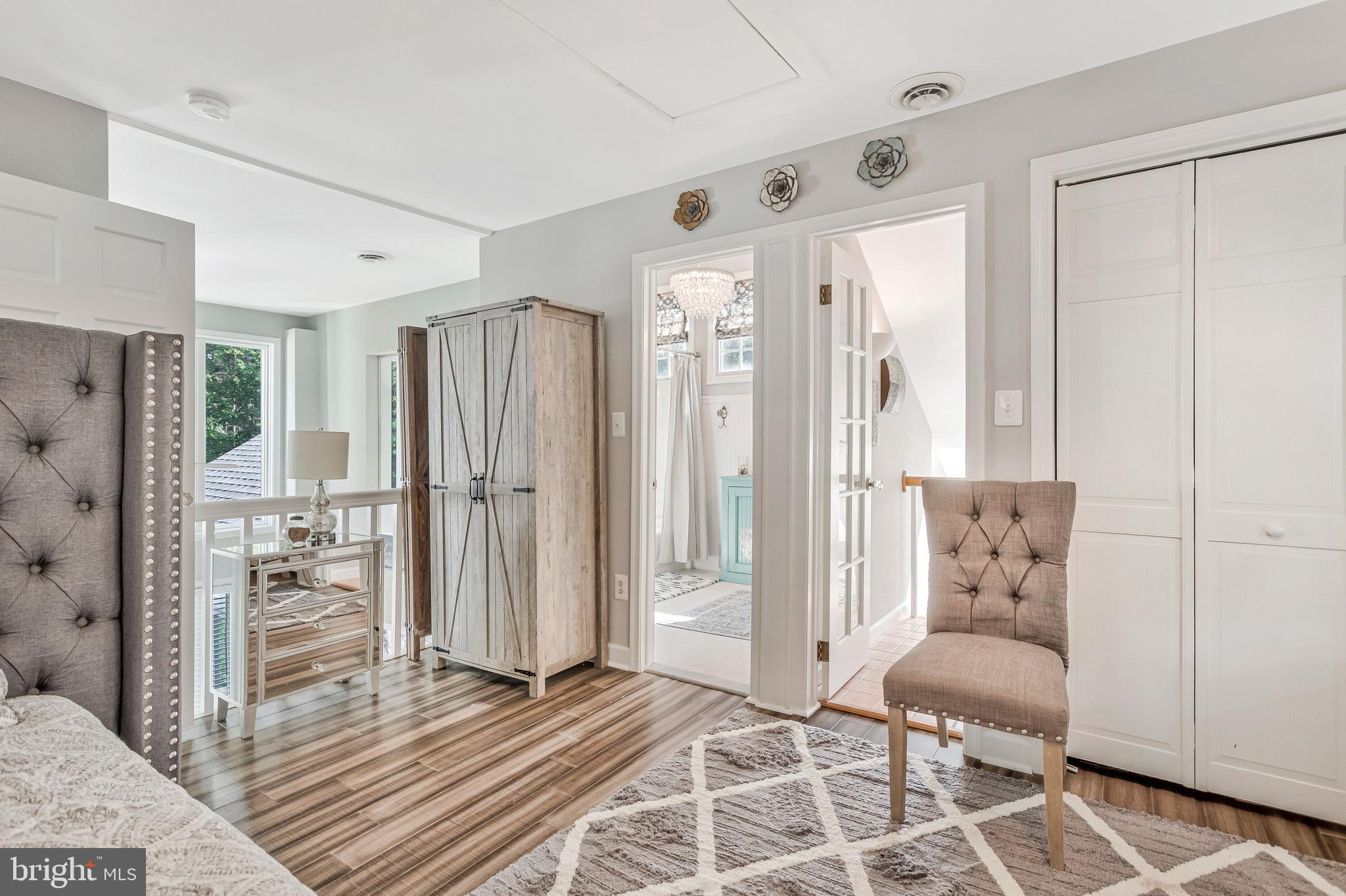 605 Barstow Road Prince Frederick, MD 20678 - Photo 24 of 57 a bedroom with furniture and a rug