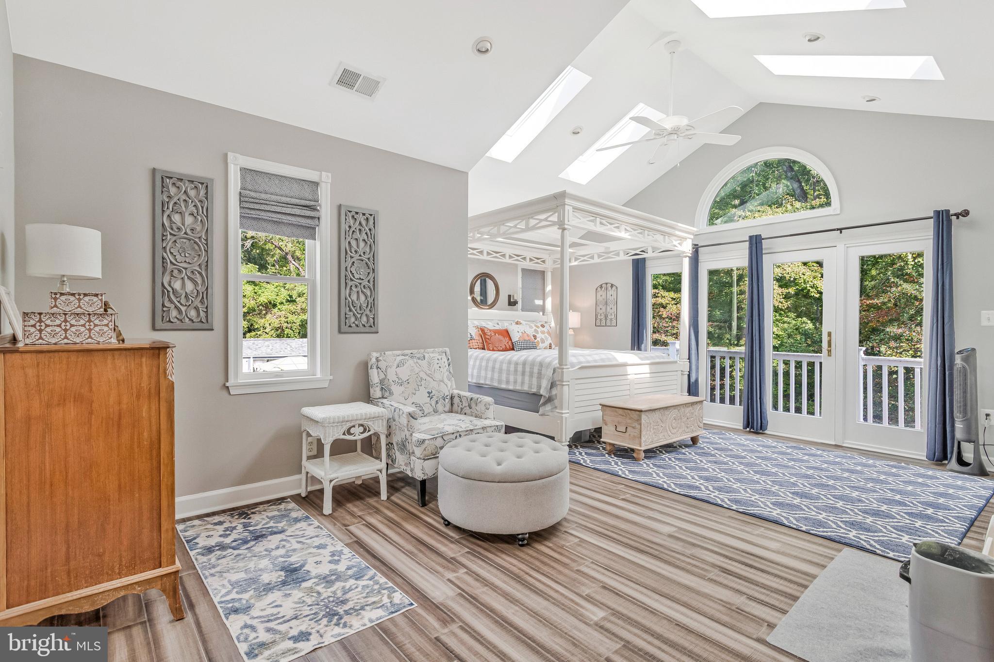 605 Barstow Road Prince Frederick, MD 20678 - Photo 26 of 57 a living room with furniture chandelier and a table