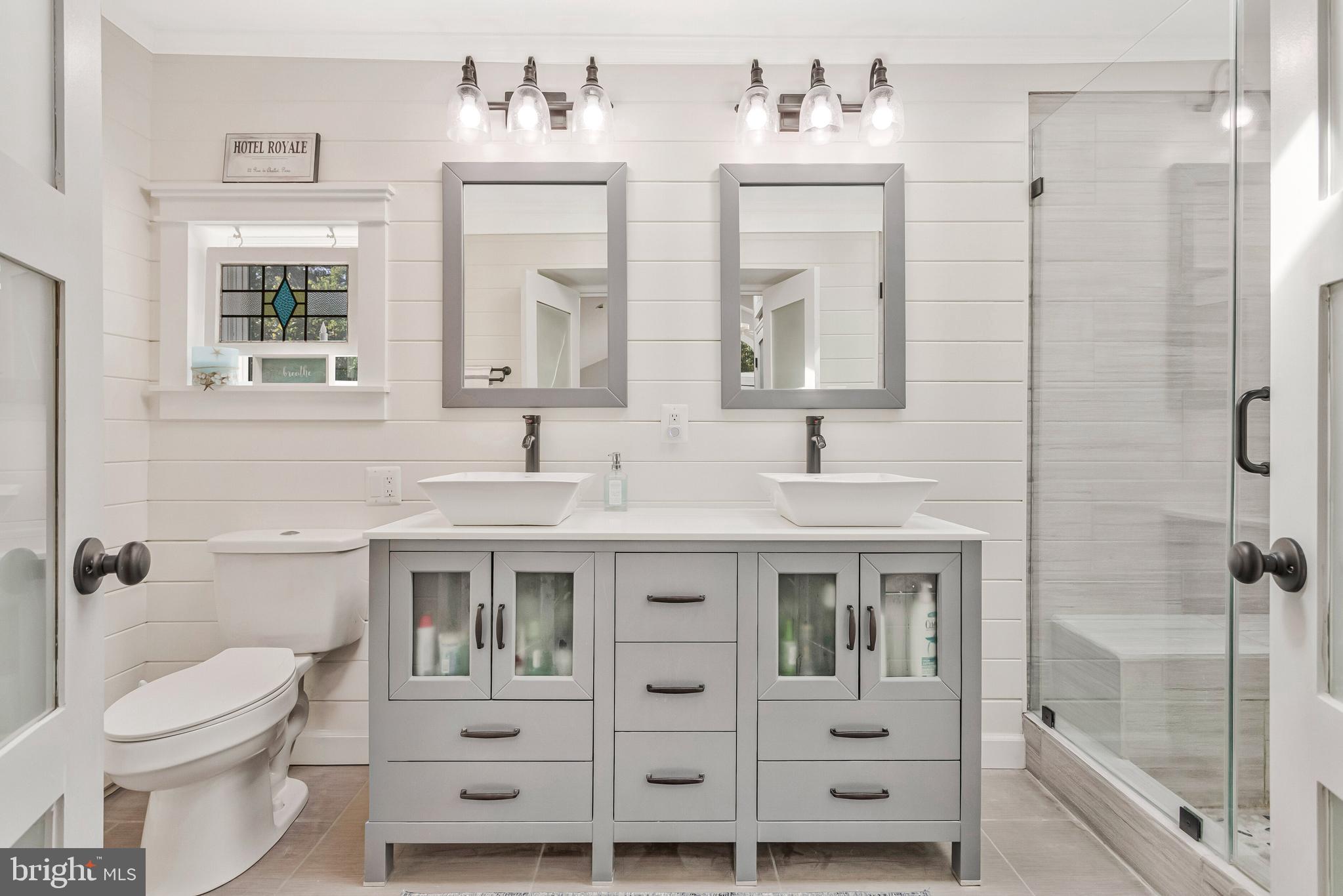 605 Barstow Road Prince Frederick, MD 20678 - Photo 29 of 57 a bathroom with a double vanity sink mirror and toilet