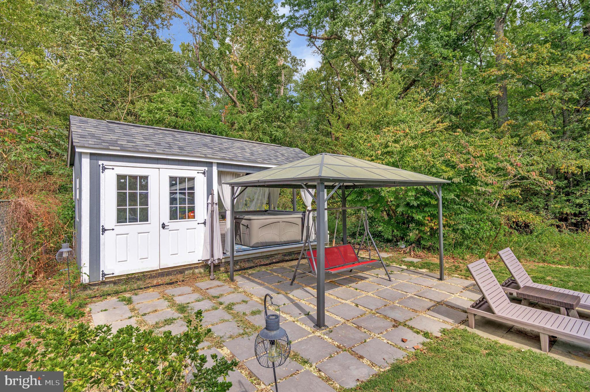 605 Barstow Road Prince Frederick, MD 20678 - Photo 35 of 57 a backyard of a house with barbeque oven fire pit table and chairs