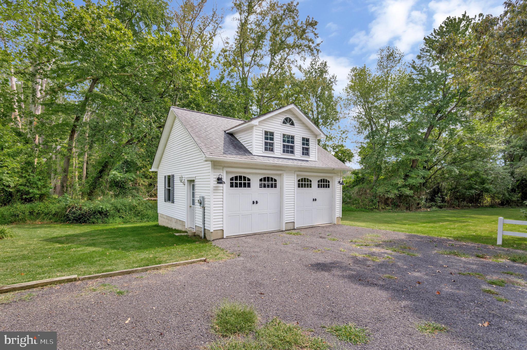 605 Barstow Road Prince Frederick, MD 20678 - Photo 37 of 57 a view of a house with a yard and large trees